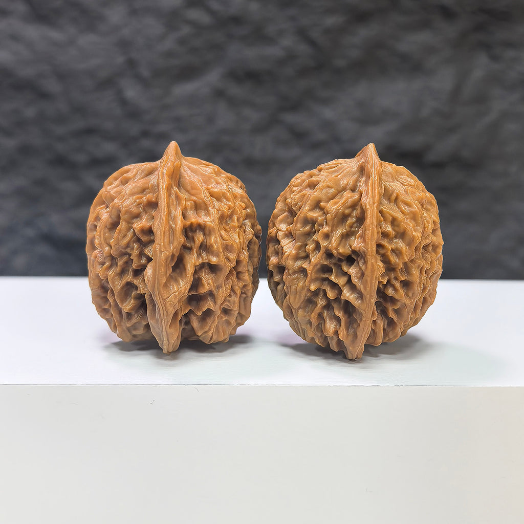 Pair of Panlong Texture Wenwan walnuts by Wenwan Art, 34mm x 31mm, showcasing intricate natural walnut patterns.