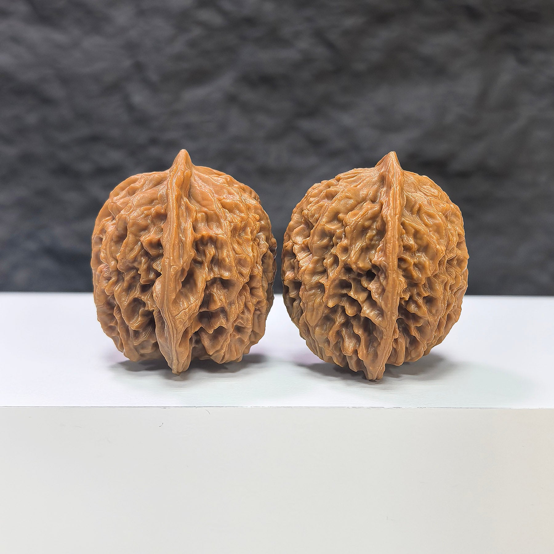 Pair of Panlong Texture Wenwan walnuts by Wenwan Art, 34mm x 31mm, showcasing intricate natural walnut patterns.