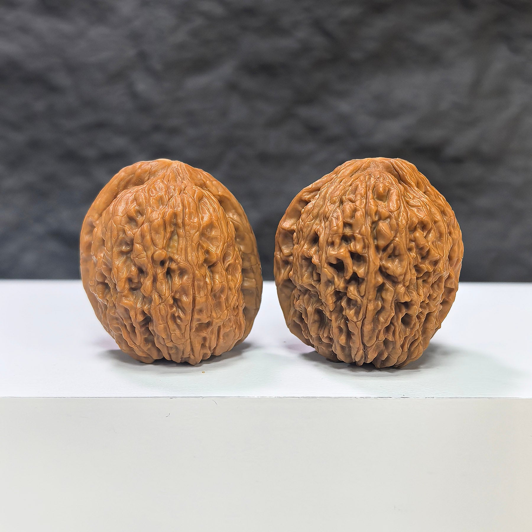 Miniature Wenwan Walnut pair with meteorite accents, 31mm size, from Wenwan Art, featuring intricate natural stone details.