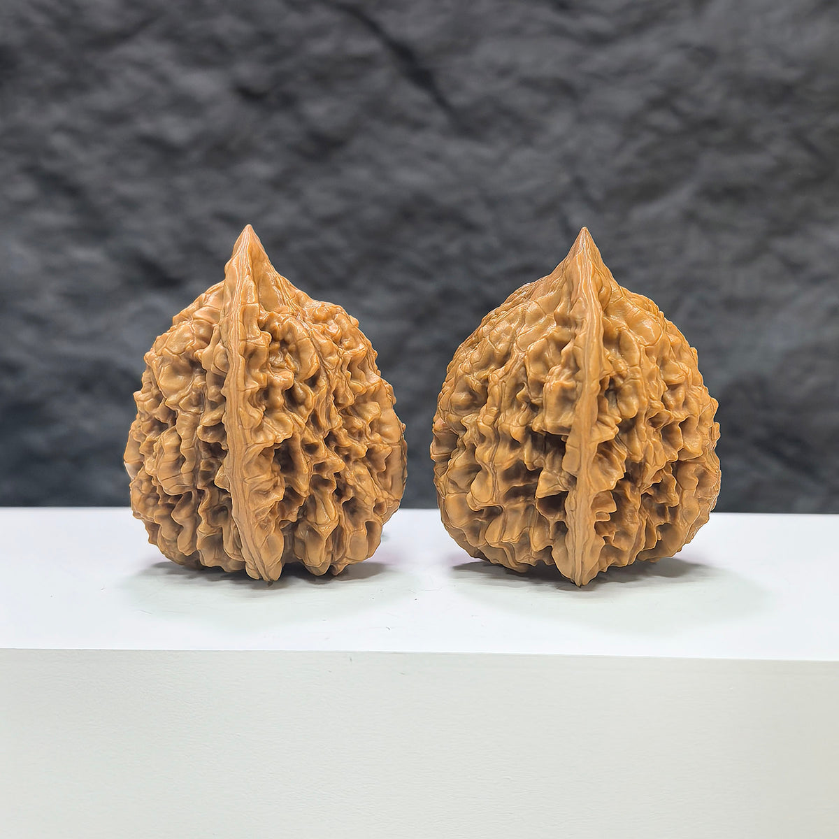 Pair of authentic Wild Wenwan Walnuts from Wenwan Art, 39mm x 38mm, featuring natural wood grain and unique textures.