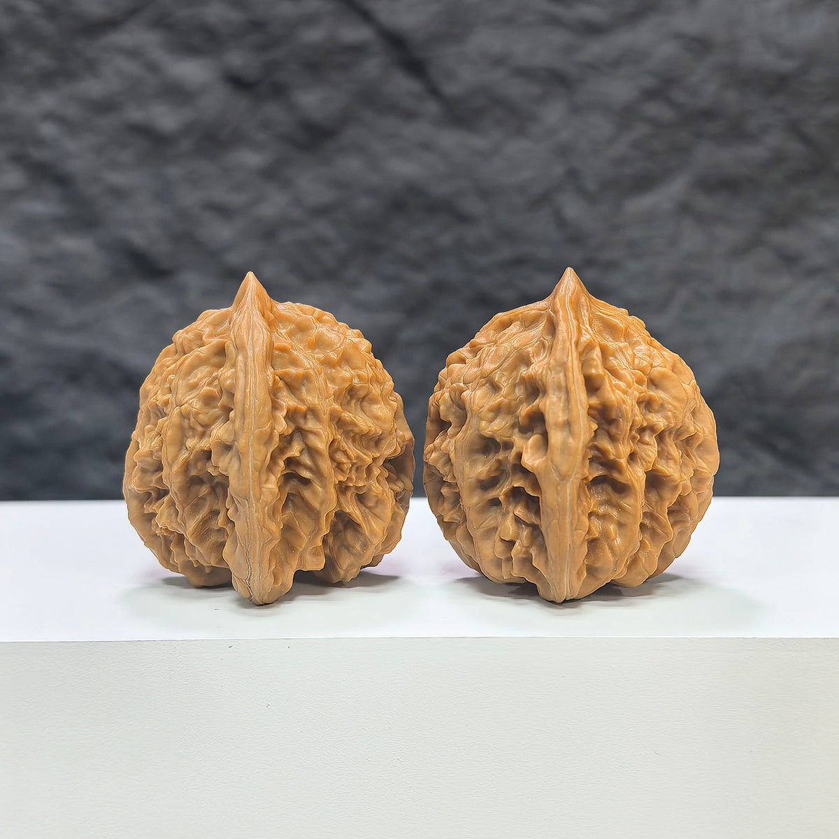 Pair of Peach Heart Concave Base Wenwan Walnuts from Wenwan Art, featuring deep base design and natural walnut texture.