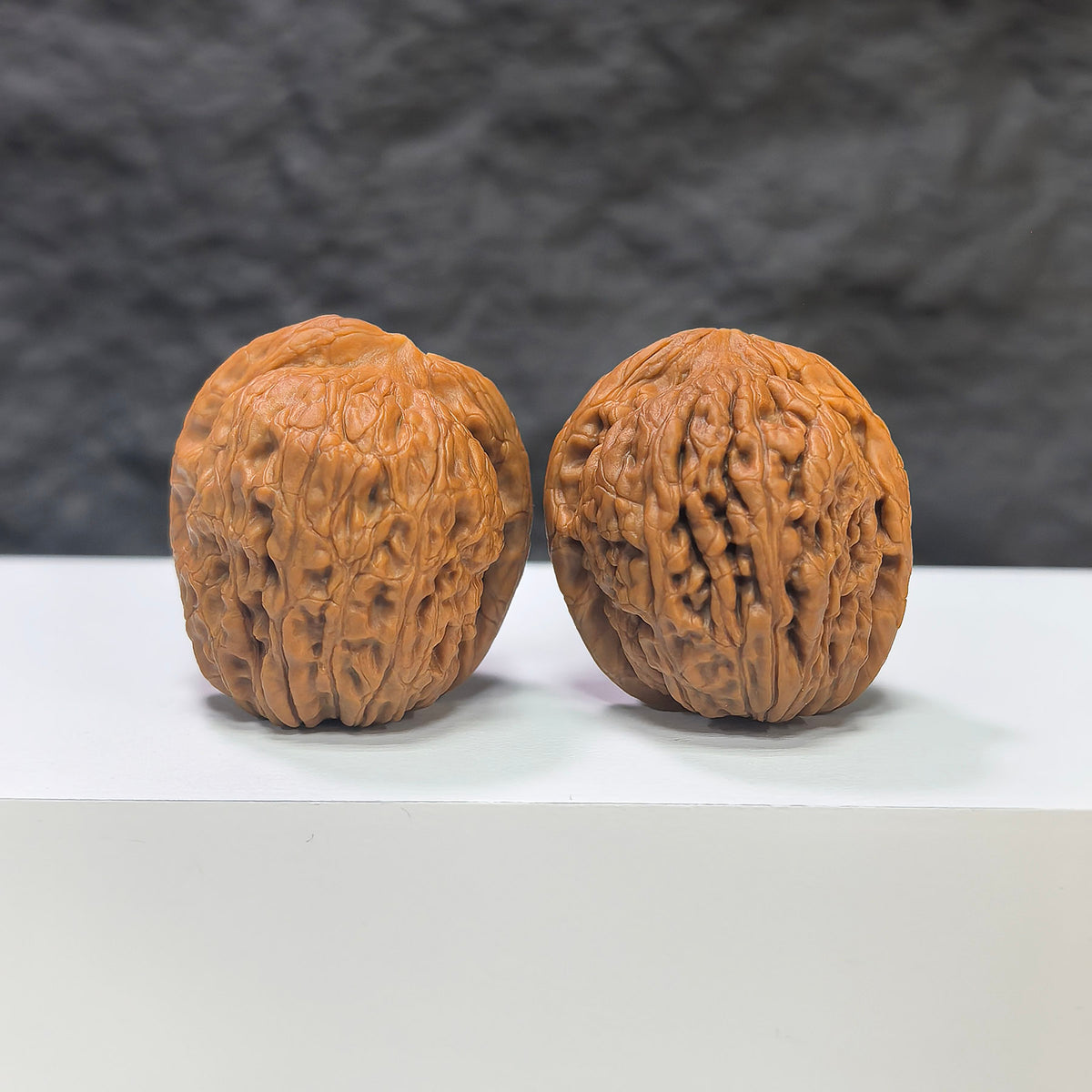 Miniature Wenwan Walnut Pair called Pocket Meteorite Sycee, 30mm x 31mm, crafted by Wenwan Art, featuring detailed natural textures.