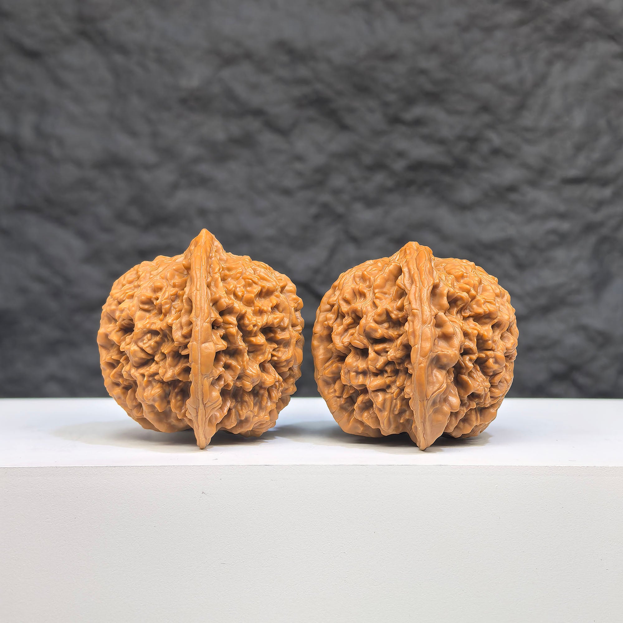 Pair of Babys Breath Full Stars Wenwan Walnuts by Wenwan Art, 38mm x 37mm, showcasing detailed carved star patterns.