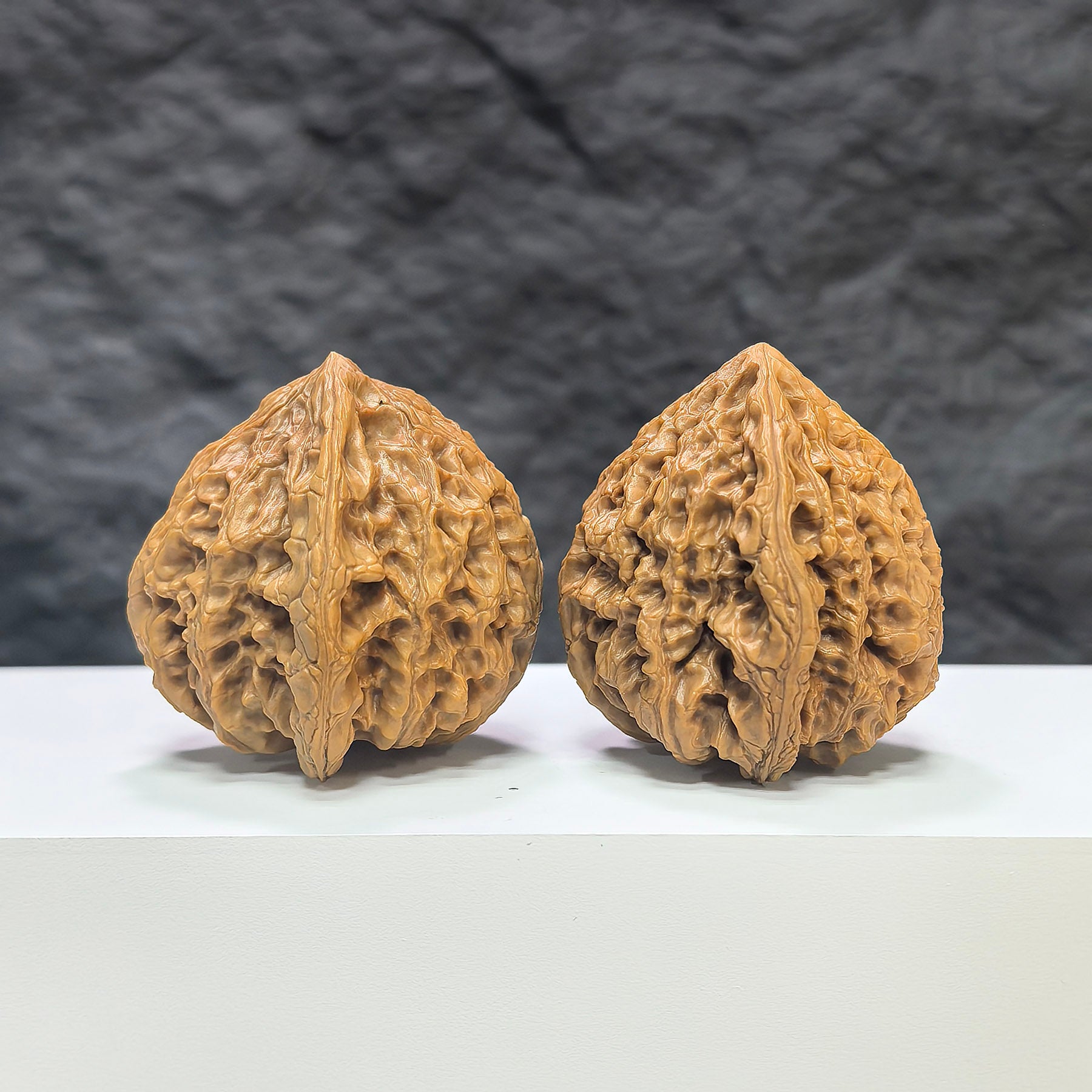 Pair of Classic Scholar Wenwan Walnuts by Wenwan Art, peach heart tiger head design, 44mm x 42mm, hand-matched walnut sculpture.