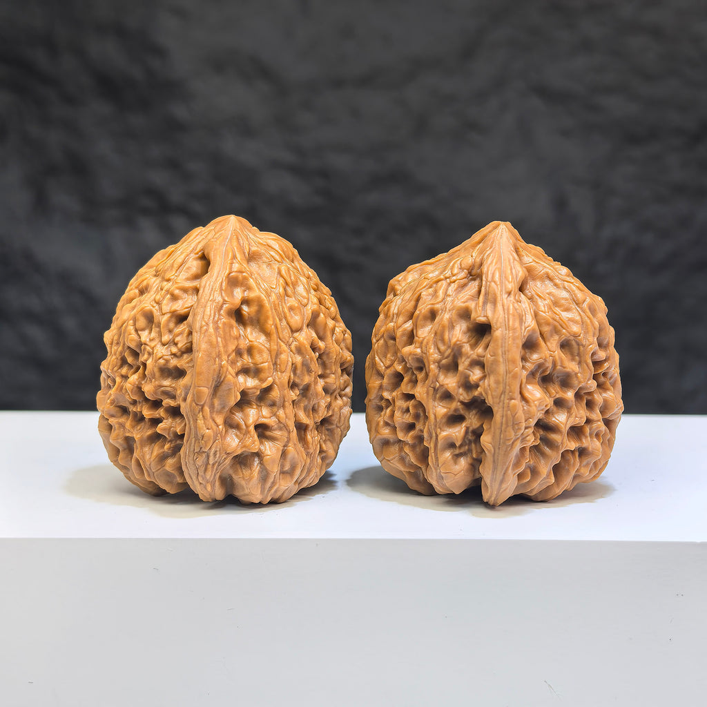 Pair of Nanjiangstone Wenwan walnuts from Wenwan Art, 36mm diameter, showcasing natural stone texture and craftsmanship.