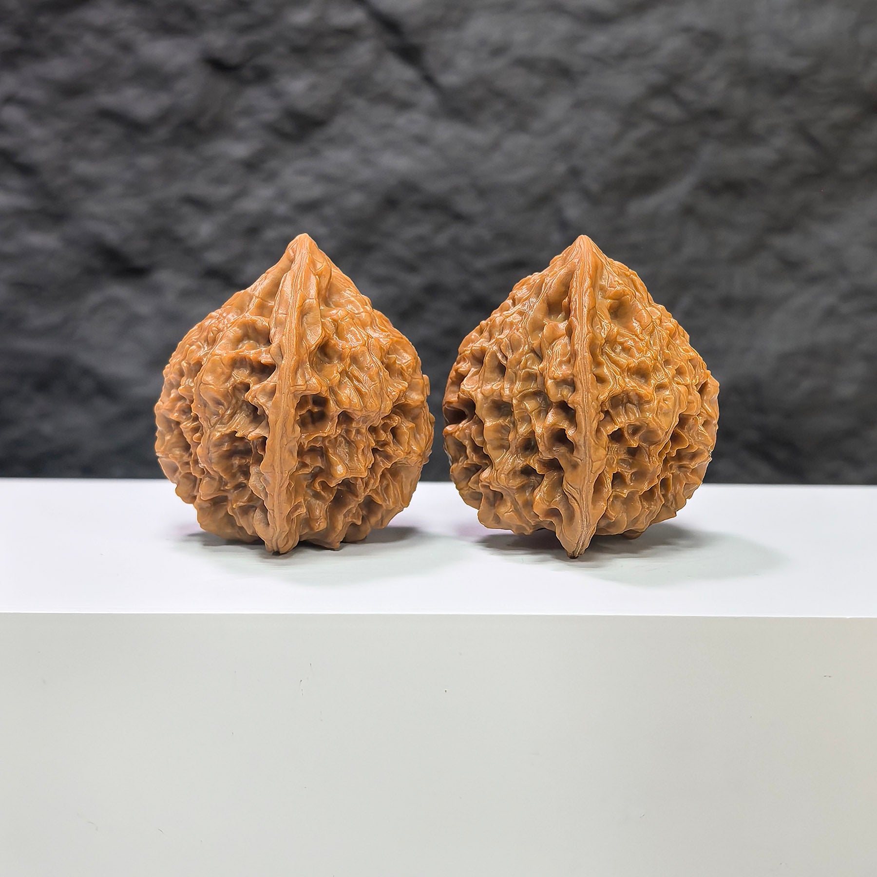 Pair of Golden Kylin Wenwan walnuts from Wenwan Art, classic 40mm x 38mm walnut sculptures with intricate carvings.