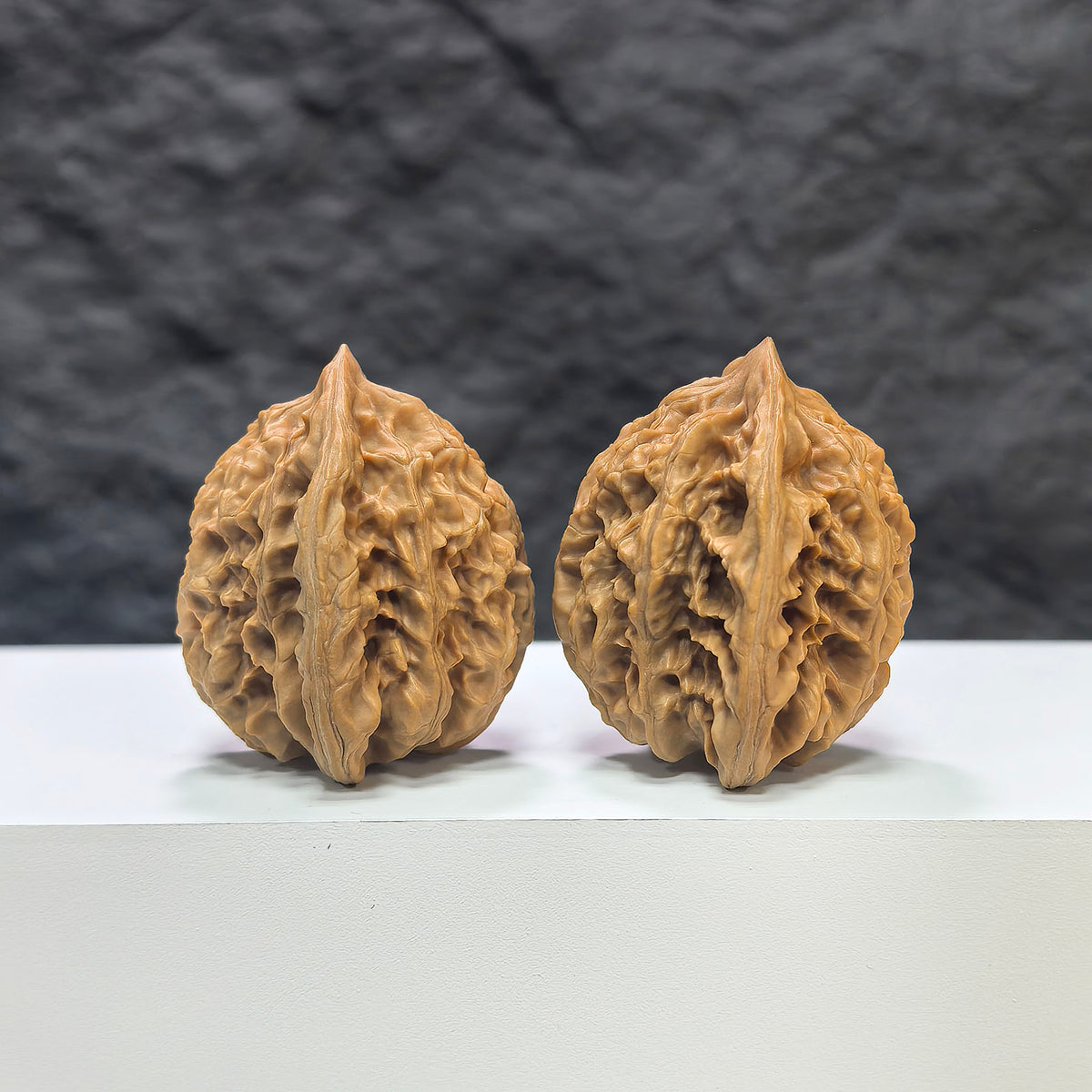 Pair of Xiayunling Classic Wenwan Walnut carvings from Wenwan Art, 37mm x 35mm, showcasing detailed natural walnut texture.