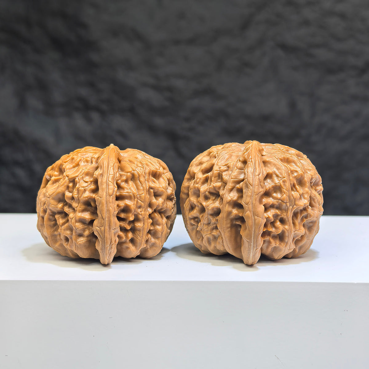 Pair of spherical white lion Wenwan walnuts from Wenwan Art, round-profile, 38mm, featuring intricate carvings and smooth white surface.