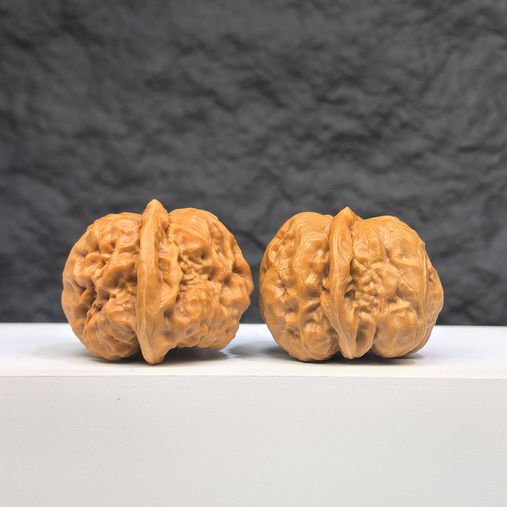 Pair of Wenwan Art "Toad Head" classic Wenwan walnuts, 37mm x 35mm, featuring detailed toad head carvings.