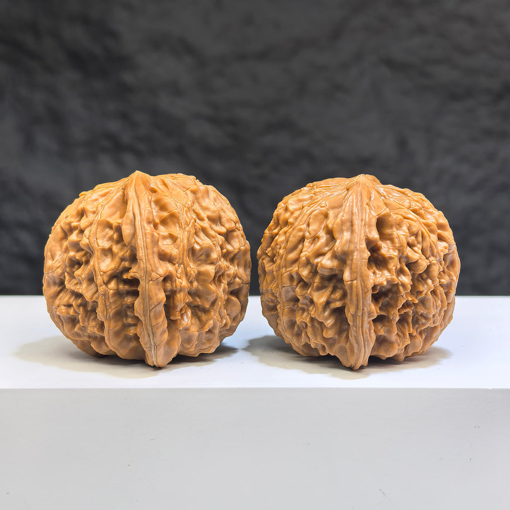 White Lion Wenwan Walnut pair by Wenwan Art, 39mm x 39mm, featuring intricate carvings and smooth polished surfaces.