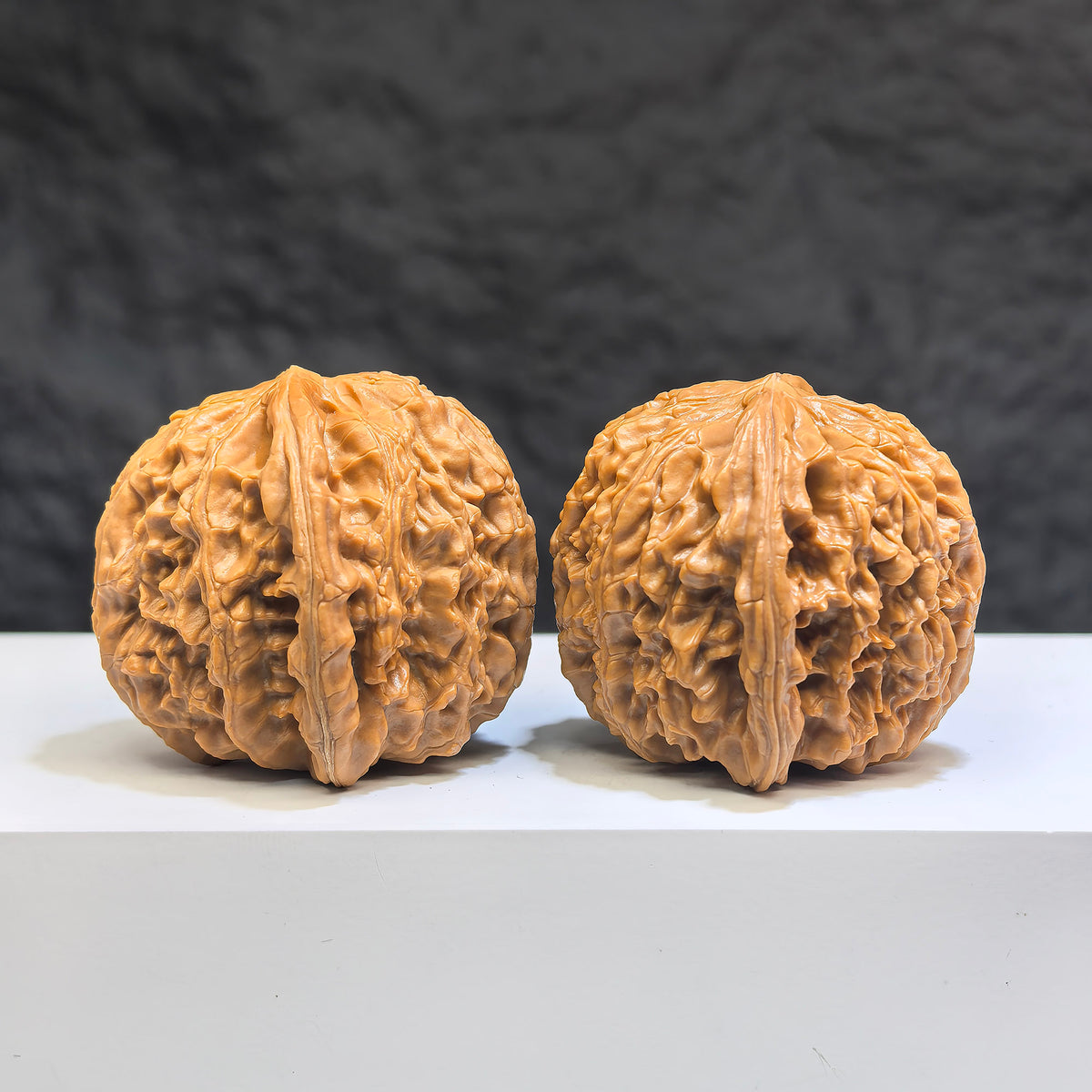 White Lion Wenwan Walnut pair by Wenwan Art, 39mm x 39mm, featuring intricate carvings and smooth polished surfaces.