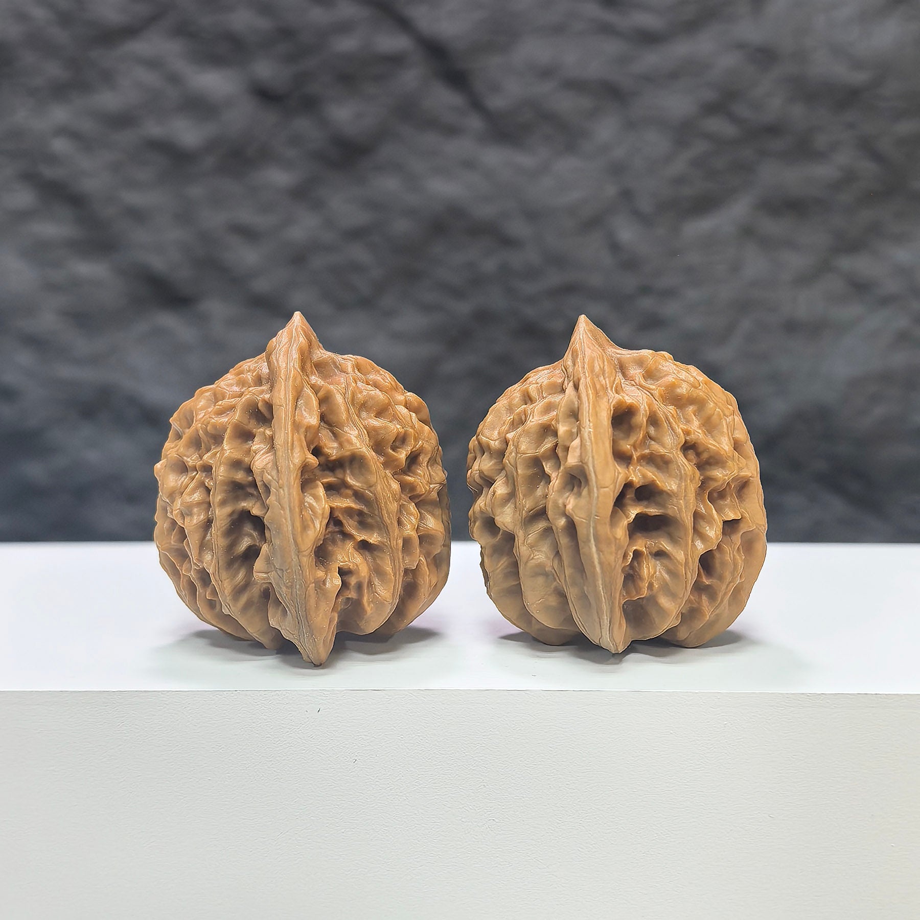 Pair of Peach Heart Xiayunling Wenwan walnuts from Wenwan Art, showcasing smooth, polished walnut shells with natural peach and heart-shaped details.