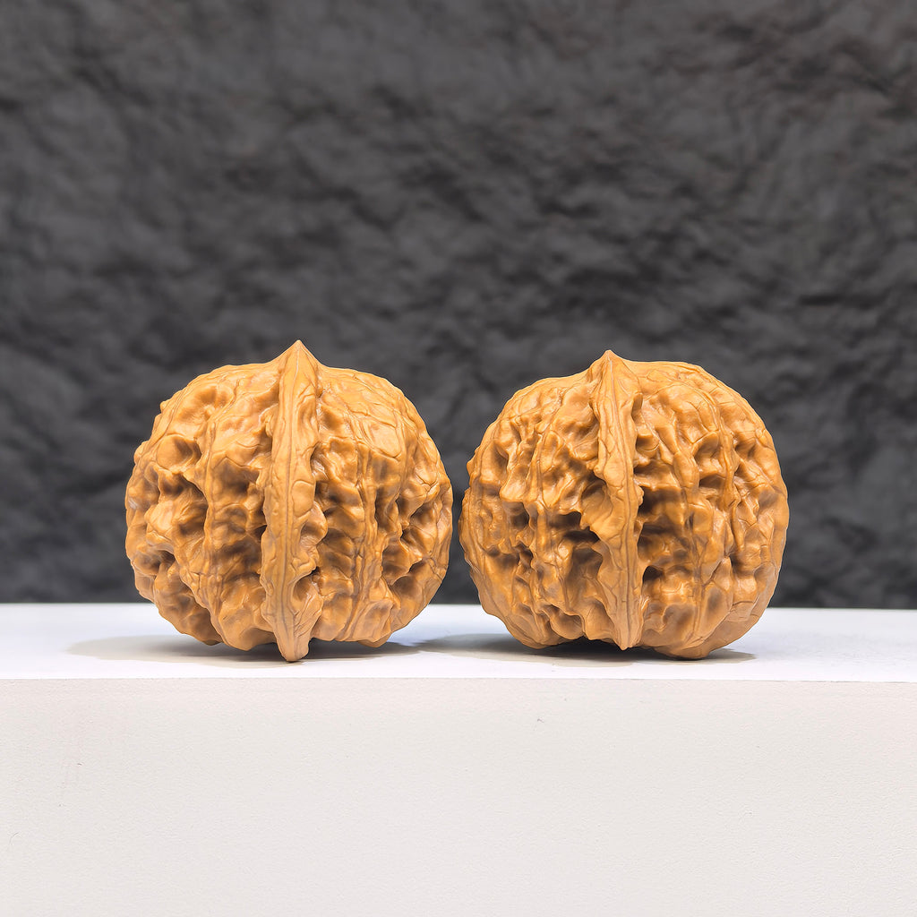 Authentic Wild Wolf Wenwan Walnut pair from Wenwan Art with natural wood grain, measuring 35mm x 37mm, displayed side by side.