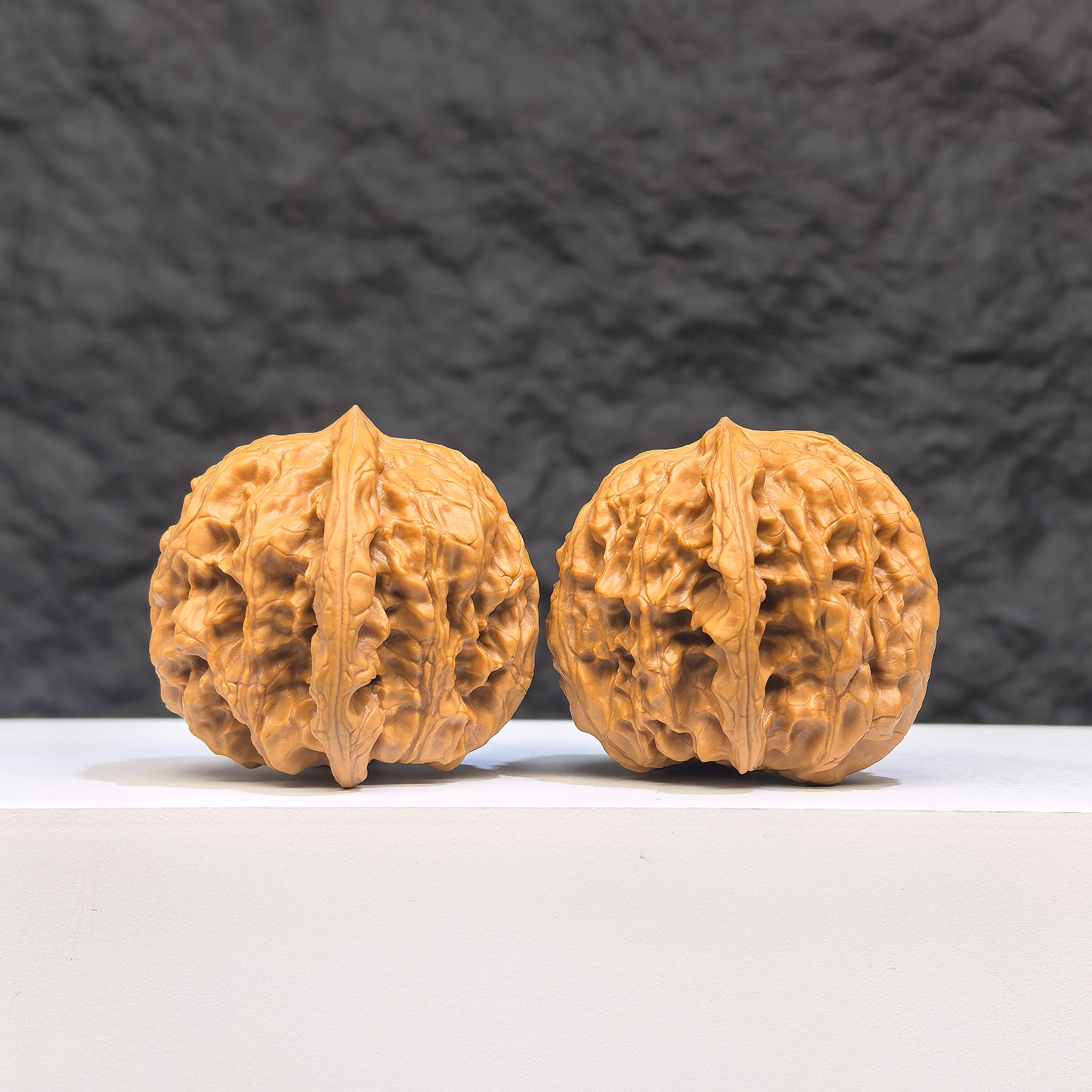 Authentic Wild Wolf Wenwan Walnut pair from Wenwan Art with natural wood grain, measuring 35mm x 37mm, displayed side by side.