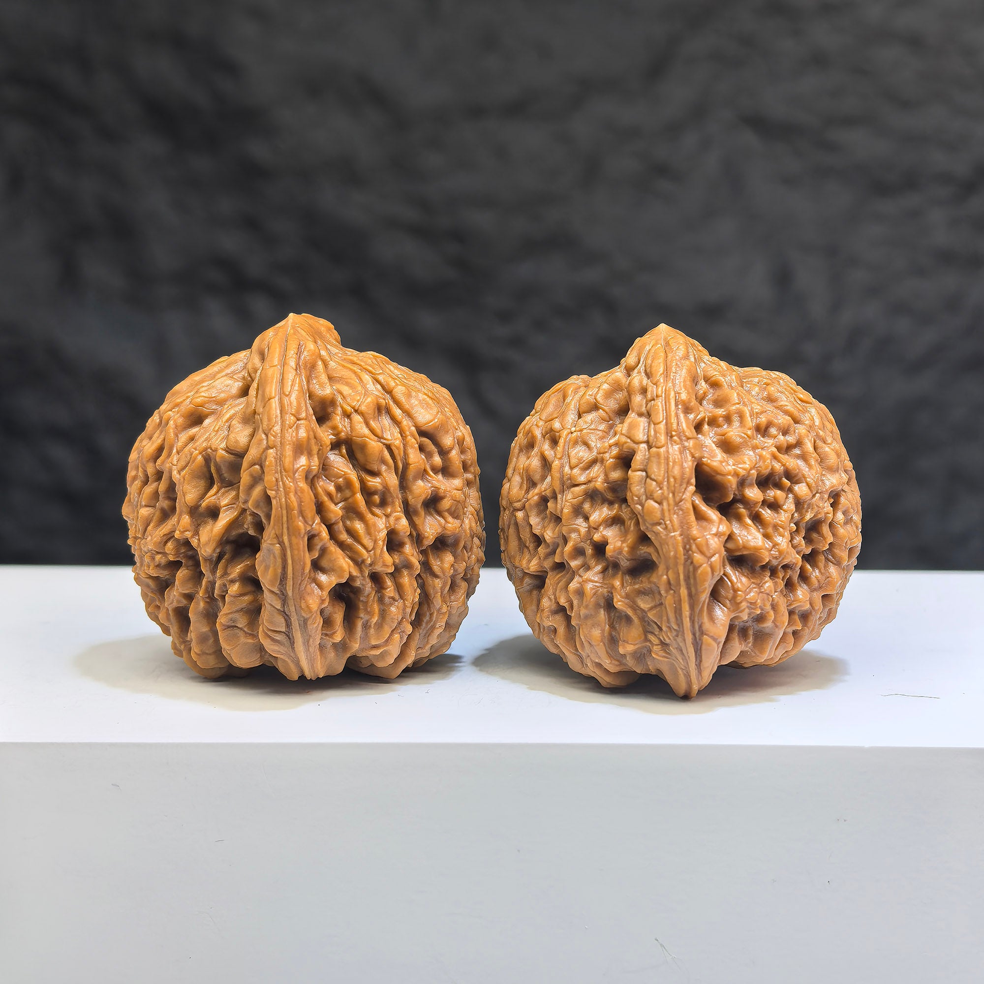 Pair of Nanjiangstone Wenwan walnuts by Wenwan Art, 37mm size, featuring natural stone textures and detailed craftsmanship.