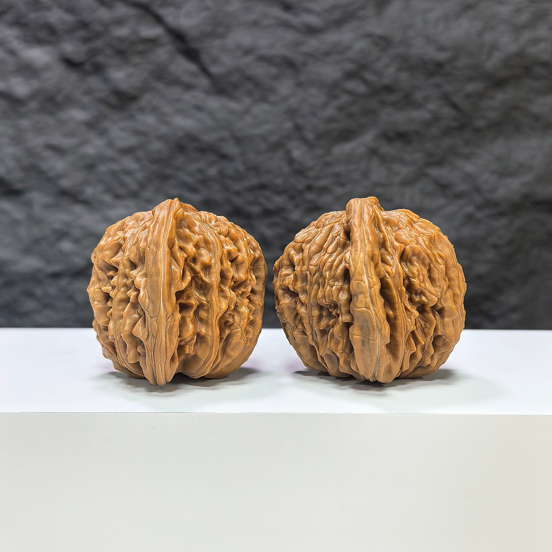 Pair of Sizuolou Wenwan walnuts from Wenwan Art, 43mm x 39mm, featuring natural wood grain and traditional craftsmanship.