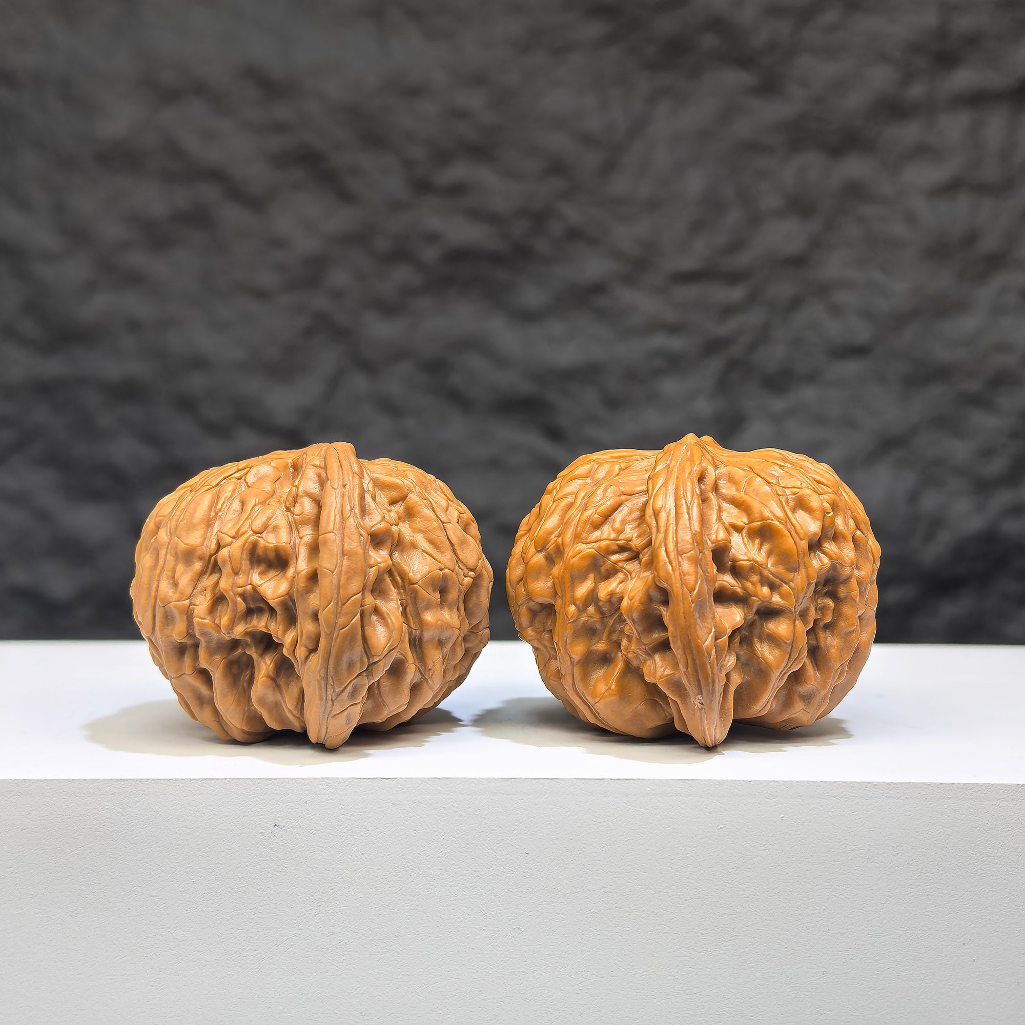 Pair of authentic Wild Wenwan Walnuts from Wenwan Art, featuring natural wild millstone pattern, 39mm x 37mm size.