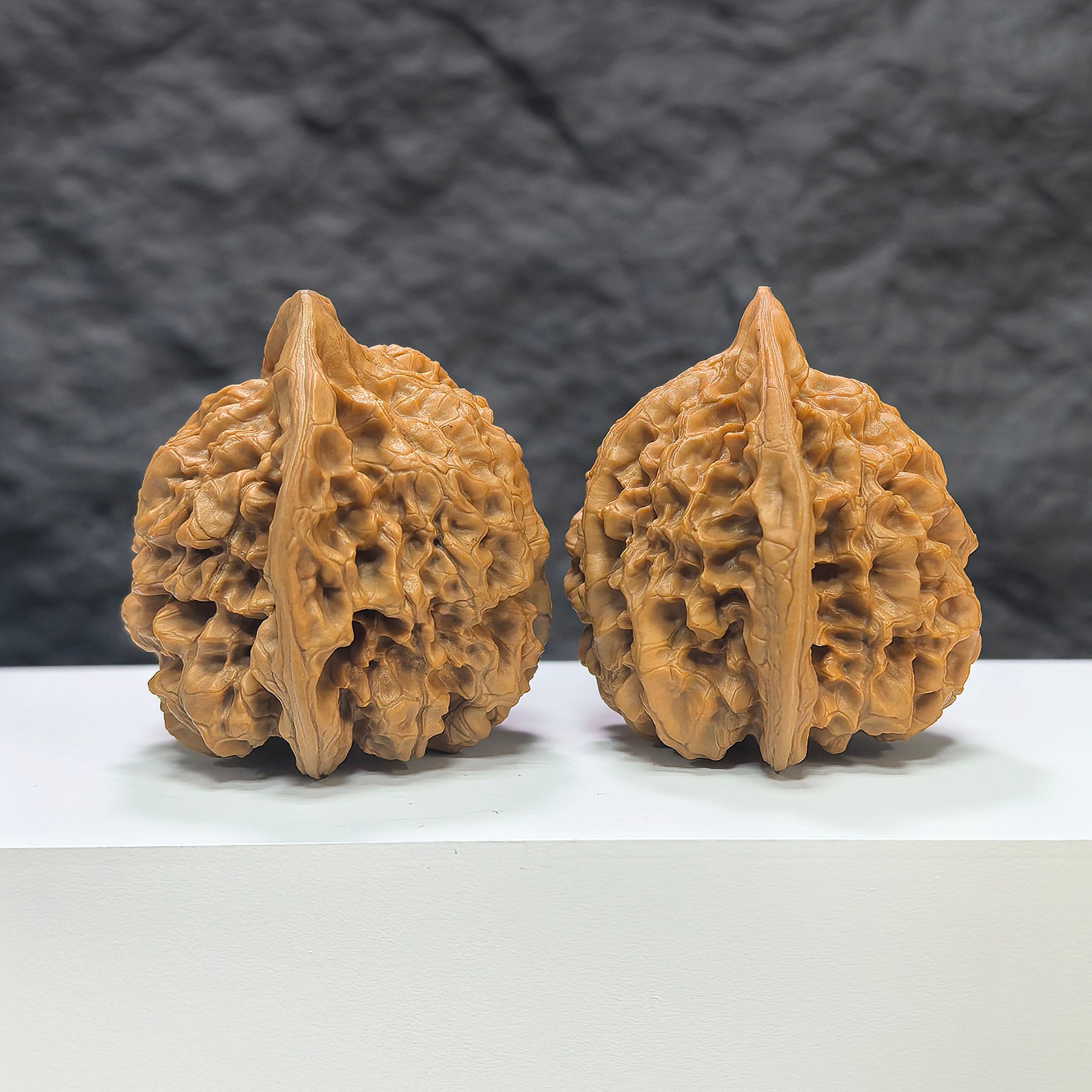 Large Wenwan Walnut pair by Wenwan Art, premium official hats, 47mm x 43mm, featuring detailed carvings on natural walnut surfaces.