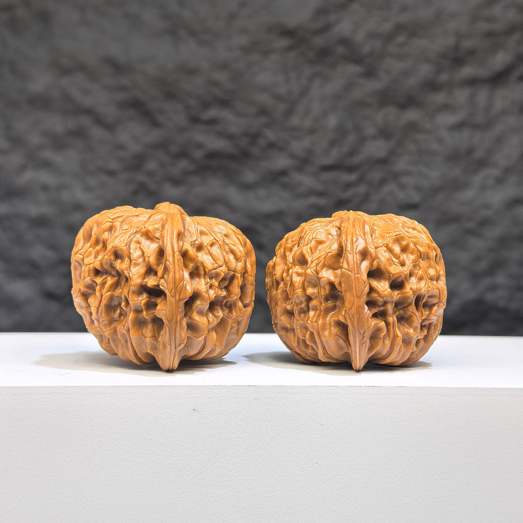 Red Shell Millstone Wenwan Walnut pair by Wenwan Art, classic HKMB-1N9, 39mm x 38mm, showcasing detailed red shell pattern and craftsmanship.