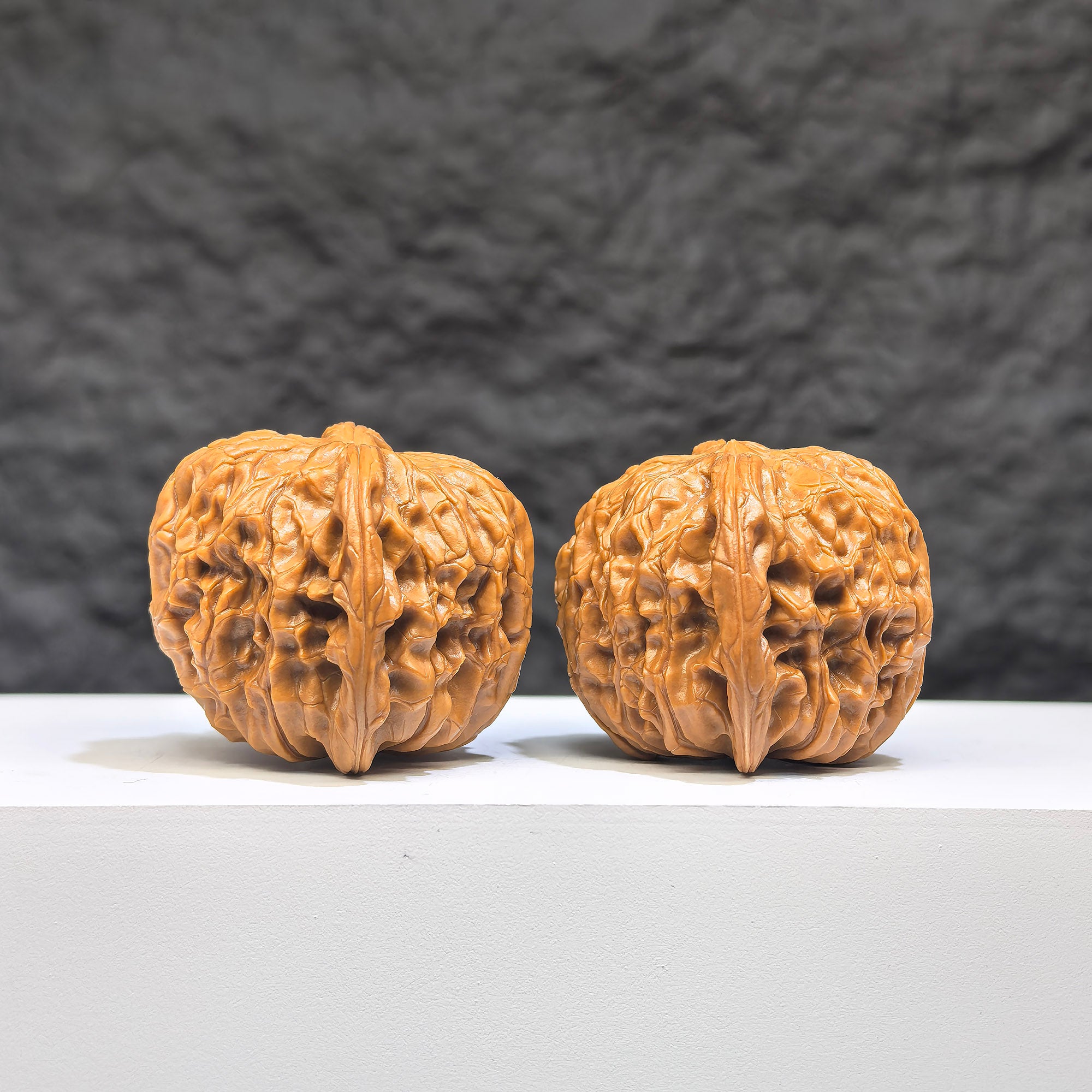 Red Shell Millstone Wenwan Walnut pair by Wenwan Art, classic HKMB-1N9, 39mm x 38mm, showcasing detailed red shell pattern and craftsmanship.