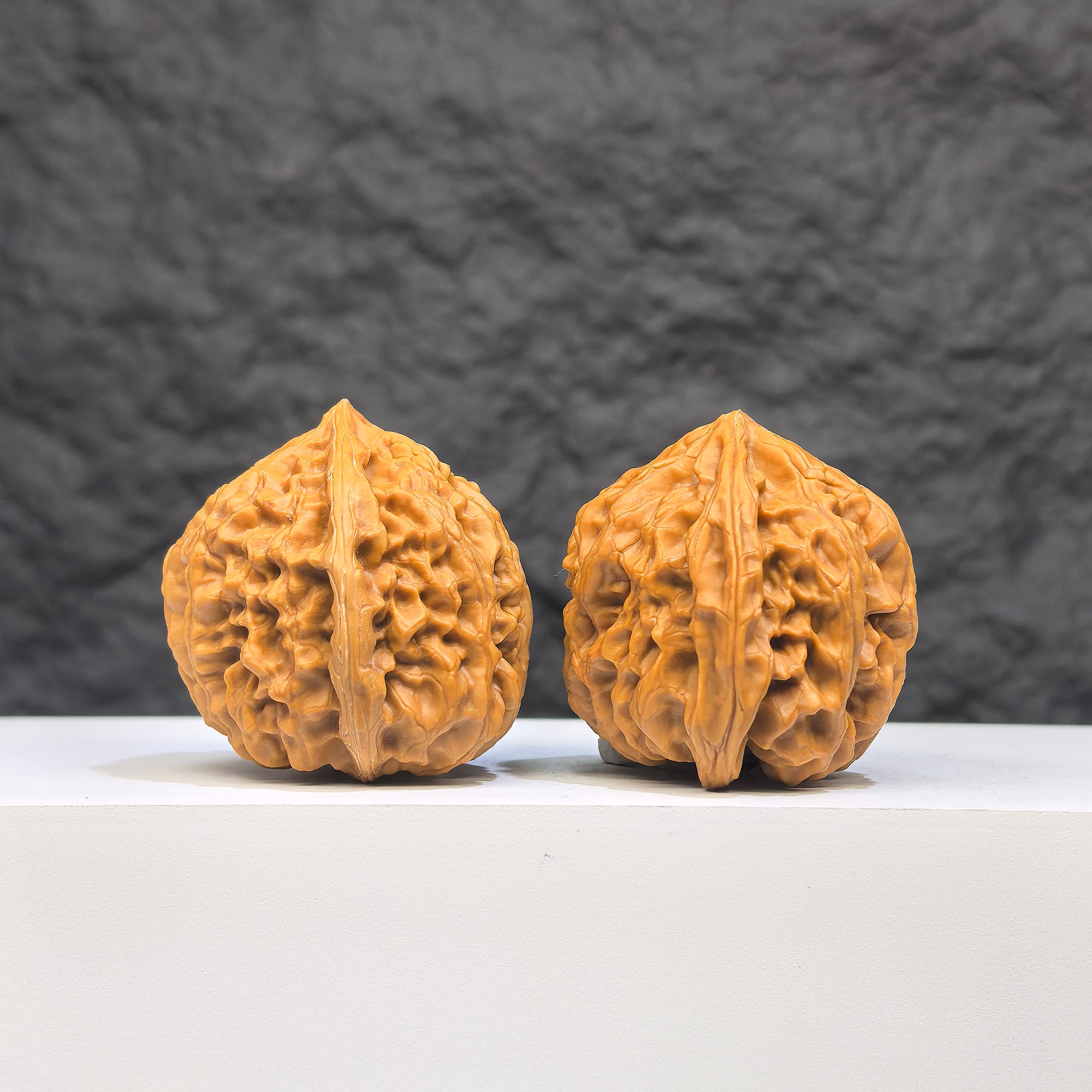 Golden Taurus Wenwan Walnut pair by Wenwan Art, 36mm x 35mm, featuring intricate natural wood grain details.