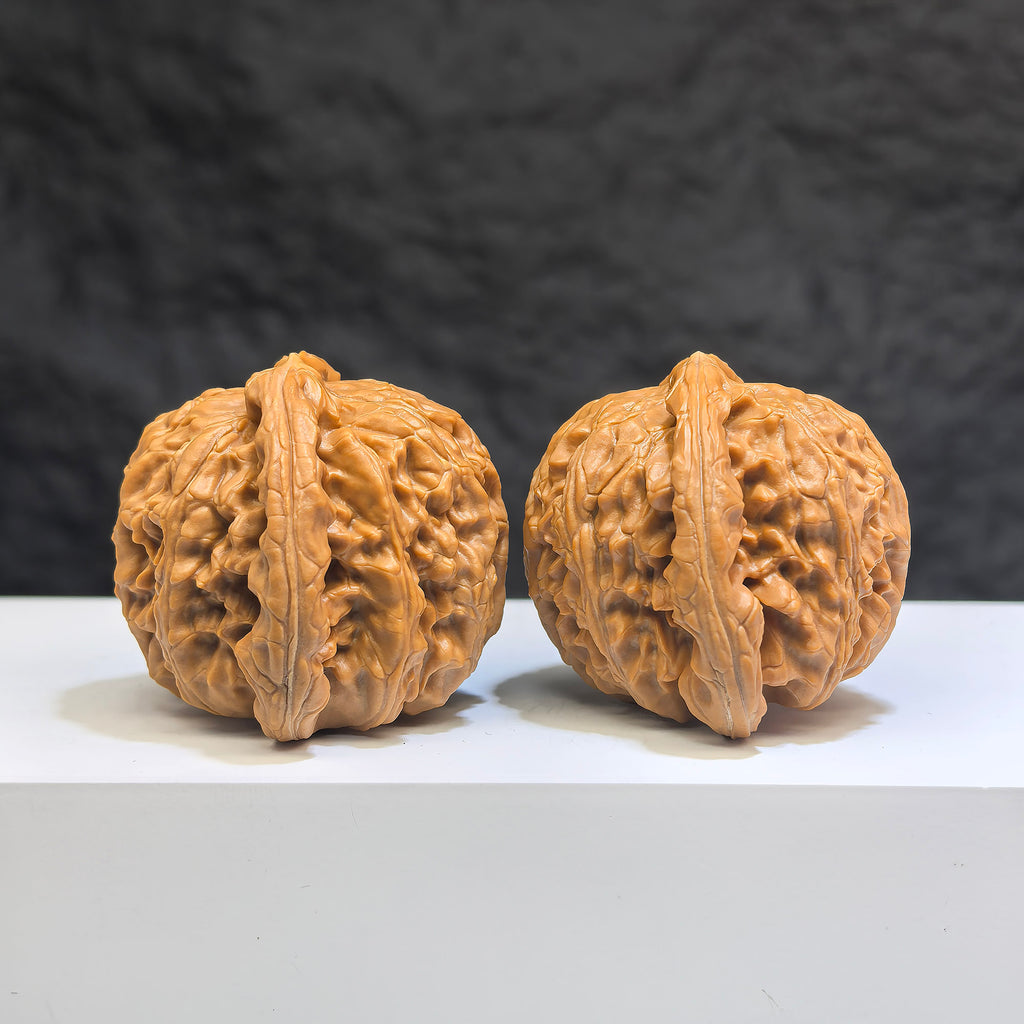 White Lion Wenwan Walnut pair by Wenwan Art, 41mm x 38mm, featuring detailed carved white lion designs on smooth walnut surfaces.