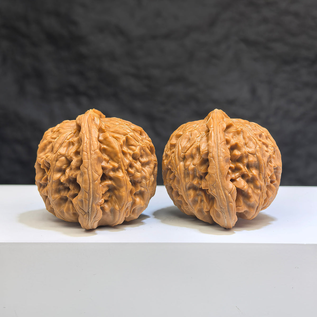 White Lion Wenwan Walnut pair by Wenwan Art, 41mm x 38mm, featuring detailed carved white lion designs on smooth walnut surfaces.