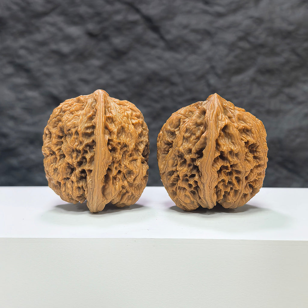 North China General Shoulder Crippled Foot Wenwan Walnut pair by Wenwan Art, 39mm x 40mm, showcasing intricate carvings and natural walnut texture.