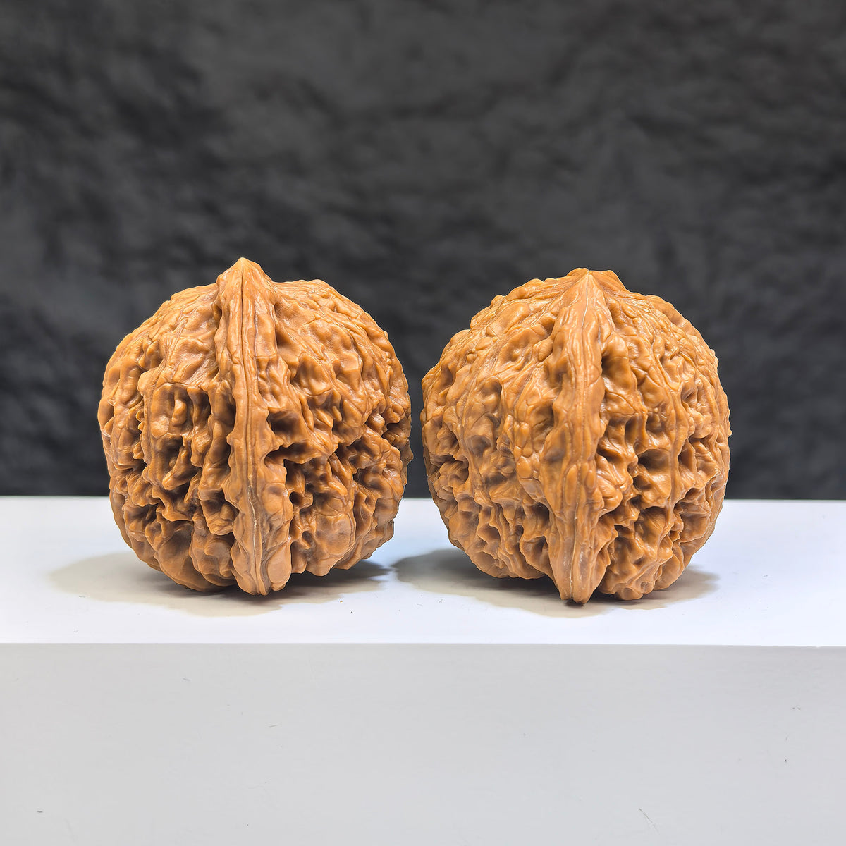 Pair of Nanjiangstone Wenwan walnuts from Wenwan Art, 38mm size, showcasing natural stone texture and craftsmanship.