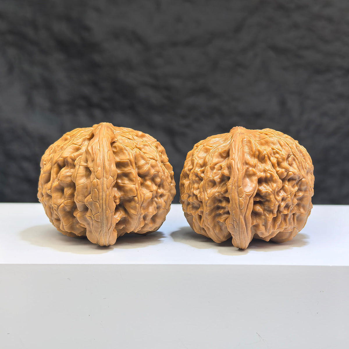 White Lion Wenwan Walnut pair by Wenwan Art, 42mm x 41mm, showcasing detailed carved white lion designs on classic walnut.