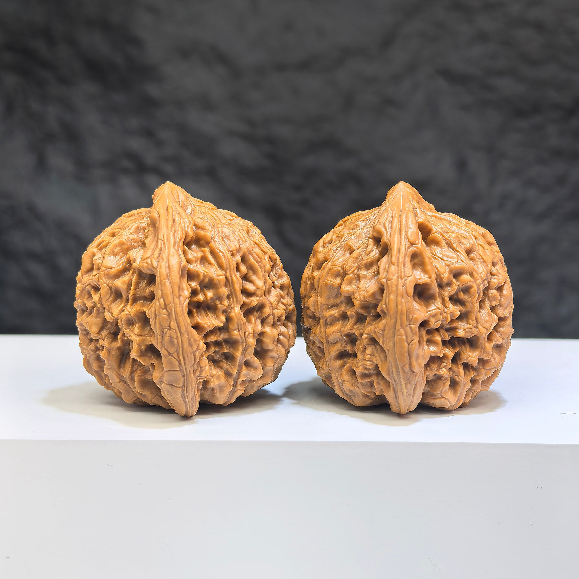 Pair of Nanjiangstone Wenwan walnuts from Wenwan Art, 38mm size, showcasing detailed natural stone texture and craftsmanship.