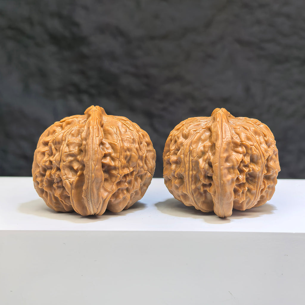 White Lion Wenwan Walnut pair by Wenwan Art, 41mm size, featuring detailed carvings of lion motifs on smooth white walnuts.