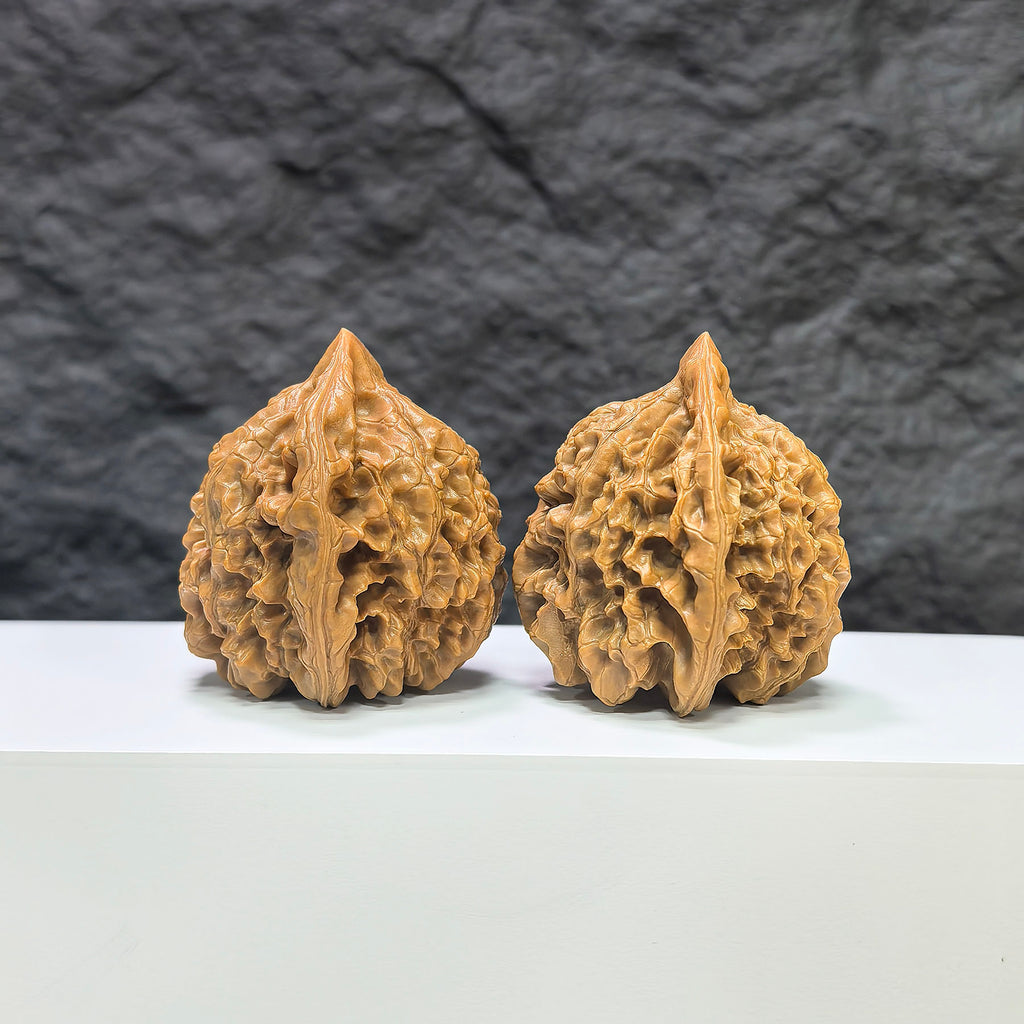 Official Wenwan Art classic walnut pair, 44mm x 42mm, featuring detailed craftsmanship and natural walnut grain.