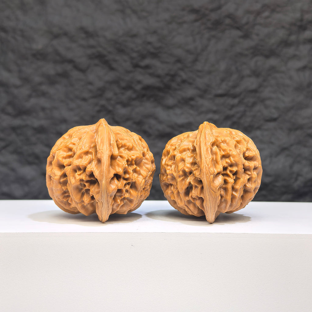 Pair of Palace Lantern Wenwan walnuts by Wenwan Art, featuring intricate carvings, measuring 42mm x 40mm, showcasing traditional craftsmanship.