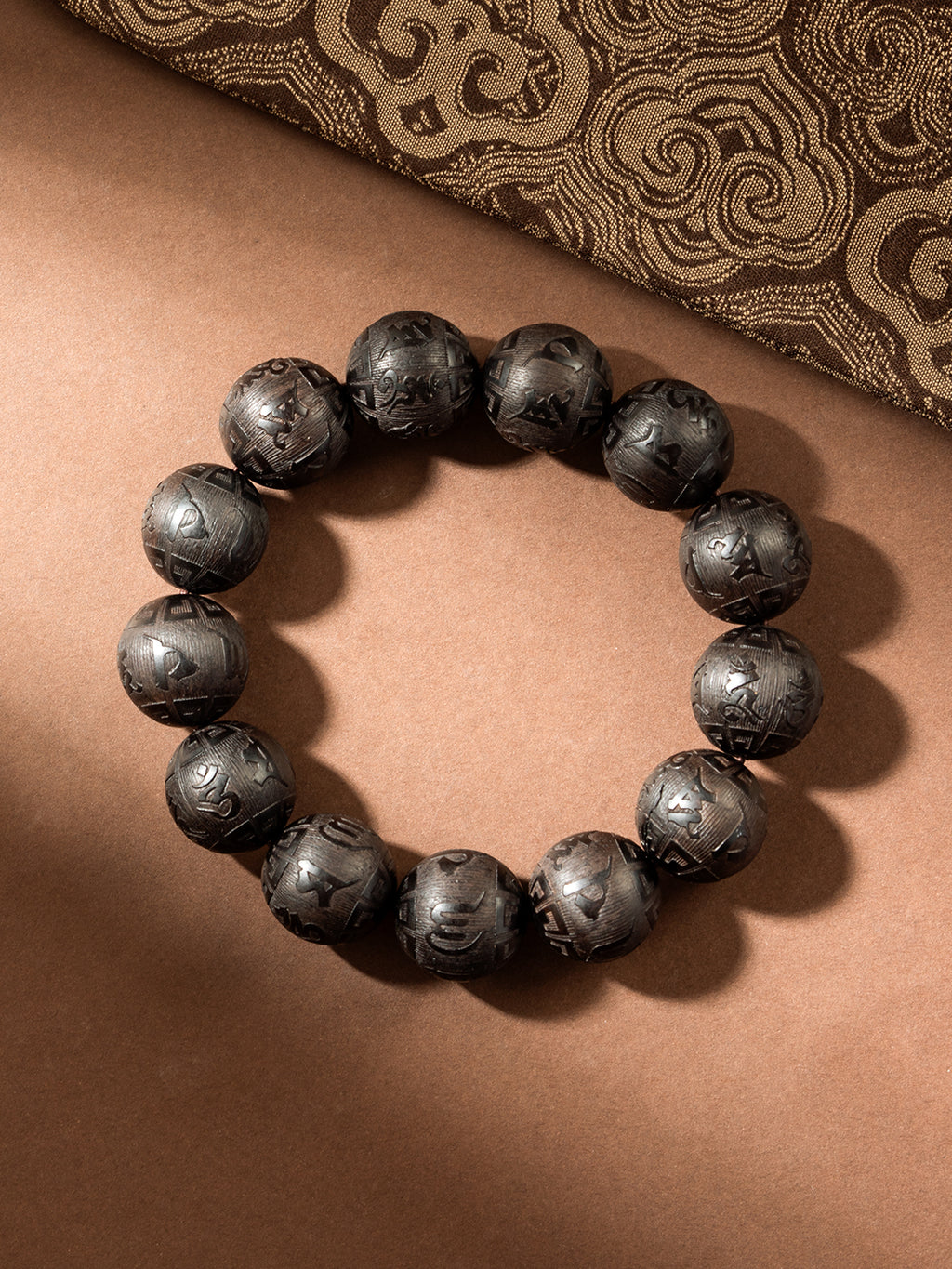 Carved ebony wood Om Mani Padme Hum bracelet with 16mm beads, featuring traditional Buddhist mantra, from ZenWenwan.
