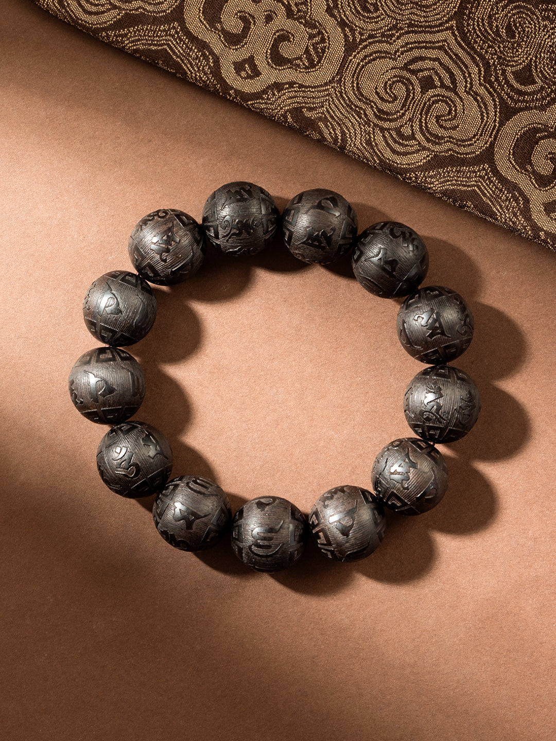 Carved ebony wood Om Mani Padme Hum bracelet with 16mm beads, featuring traditional Buddhist mantra, from ZenWenwan.