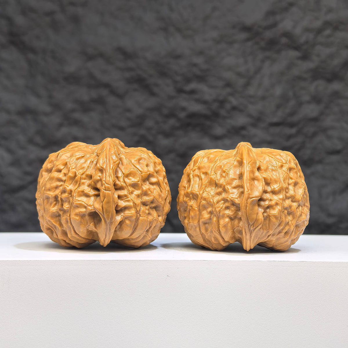 Pair of Pumpkin Pier Wenwan Walnuts from Wenwan Art, 40mm x 42mm, featuring intricate carvings and natural walnut textures.