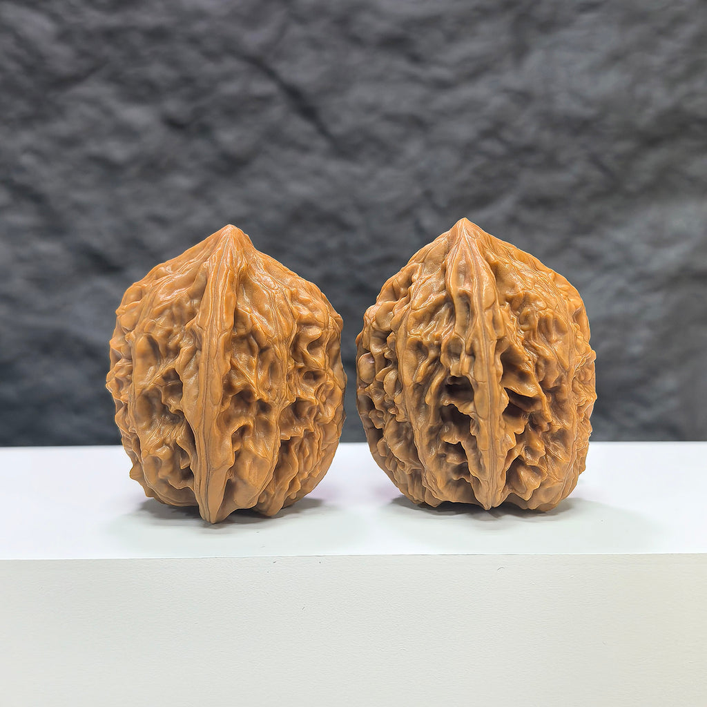 Pair of Beijing Chicken Heart Wenwan walnuts from Wenwan Art, featuring smooth, rounded 41mm x 40mm walnuts with distinctive natural patterns.