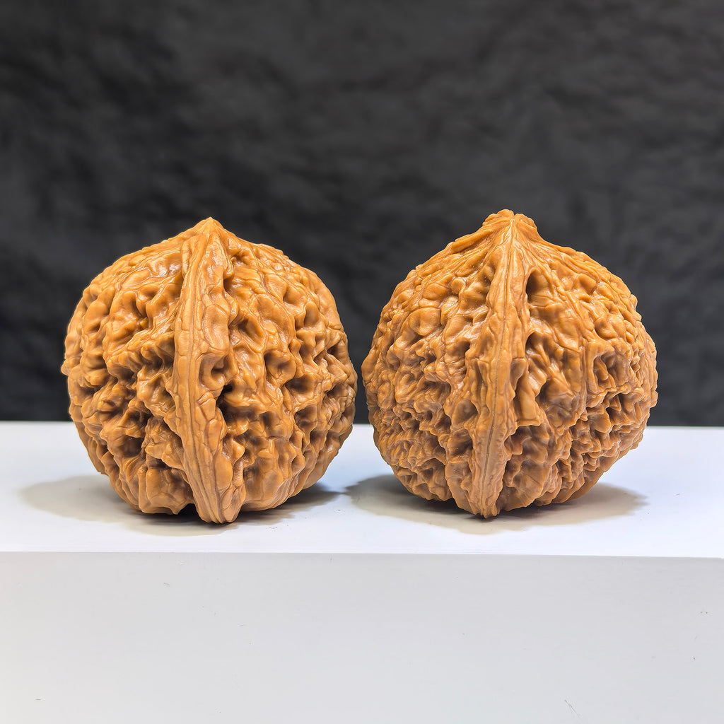 Pair of Nanjiangstone Wenwan walnuts by Wenwan Art, 40mm diameter, showcasing smooth, polished walnut-shaped carvings.