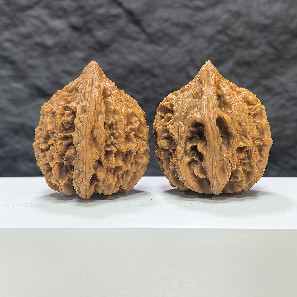 Pair of Dazhan Stone Wenwan walnuts by Wenwan Art, 42mm x 46mm, featuring polished classic walnut carvings.