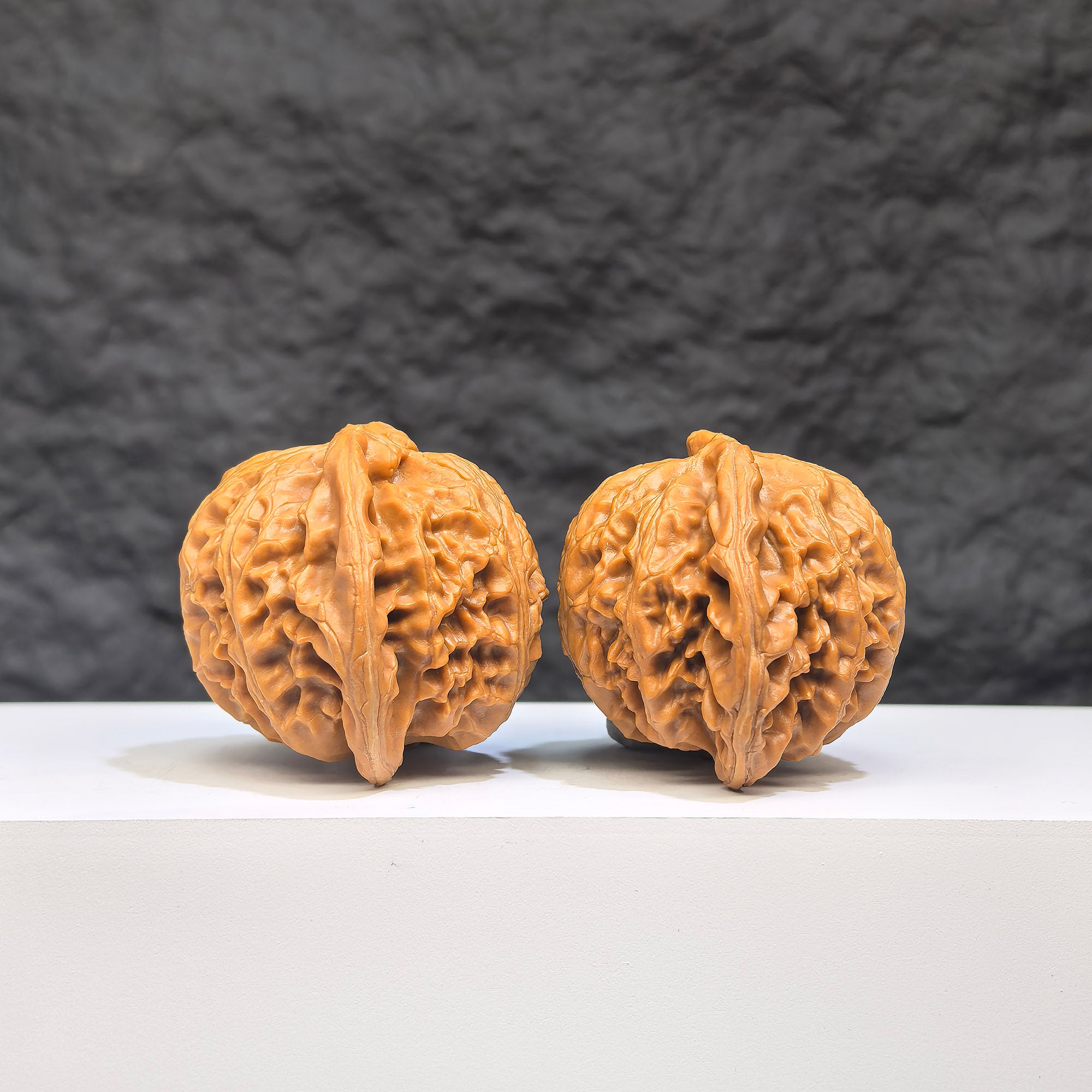 Pair of Wenwan Art Palace Lantern Wenwan walnuts, 44mm x 38mm, showcasing intricate carvings and traditional design.
