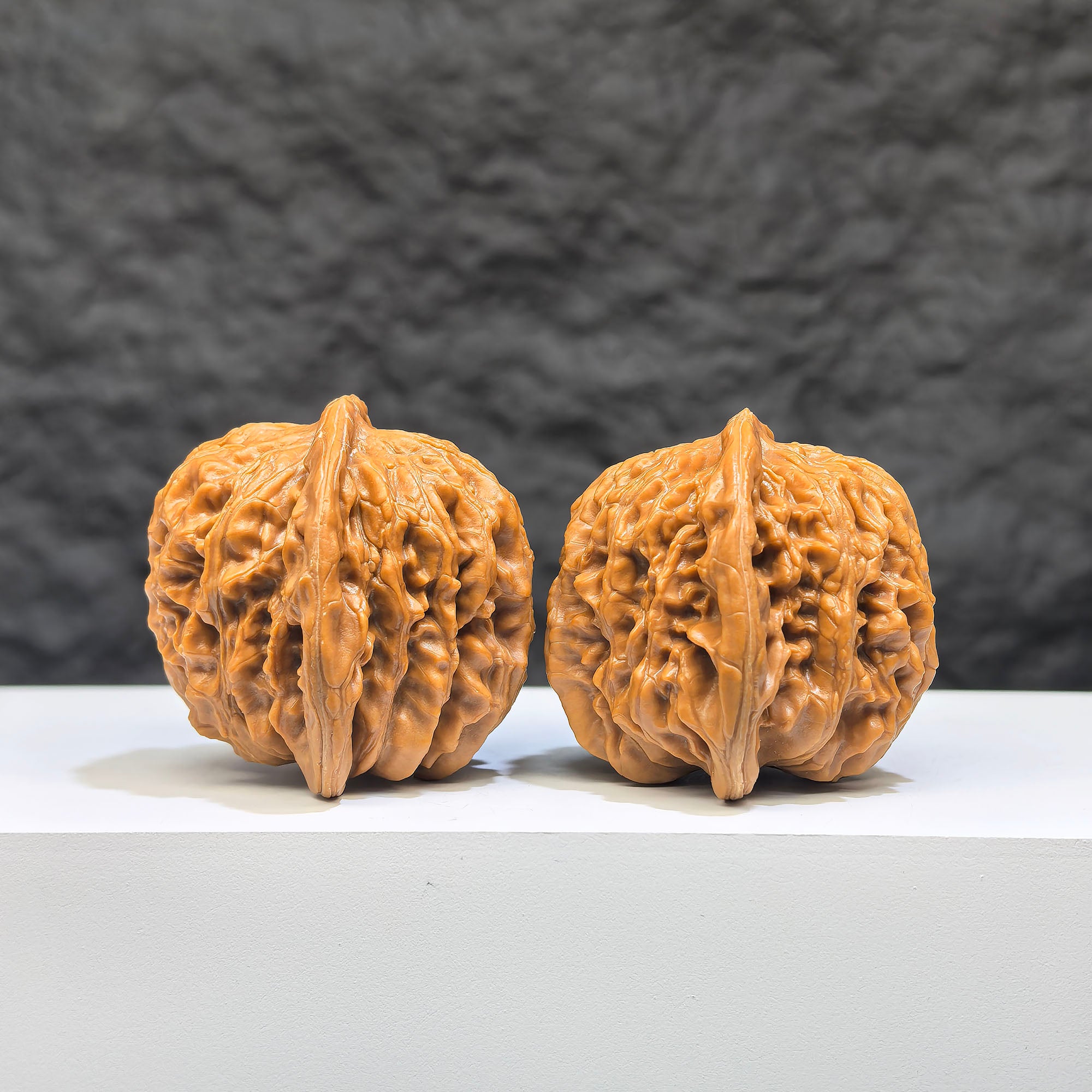 Pair of Sizuolou Wenwan walnuts from Wenwan Art, 40mm x 37mm, showcasing detailed carved walnut art pieces.