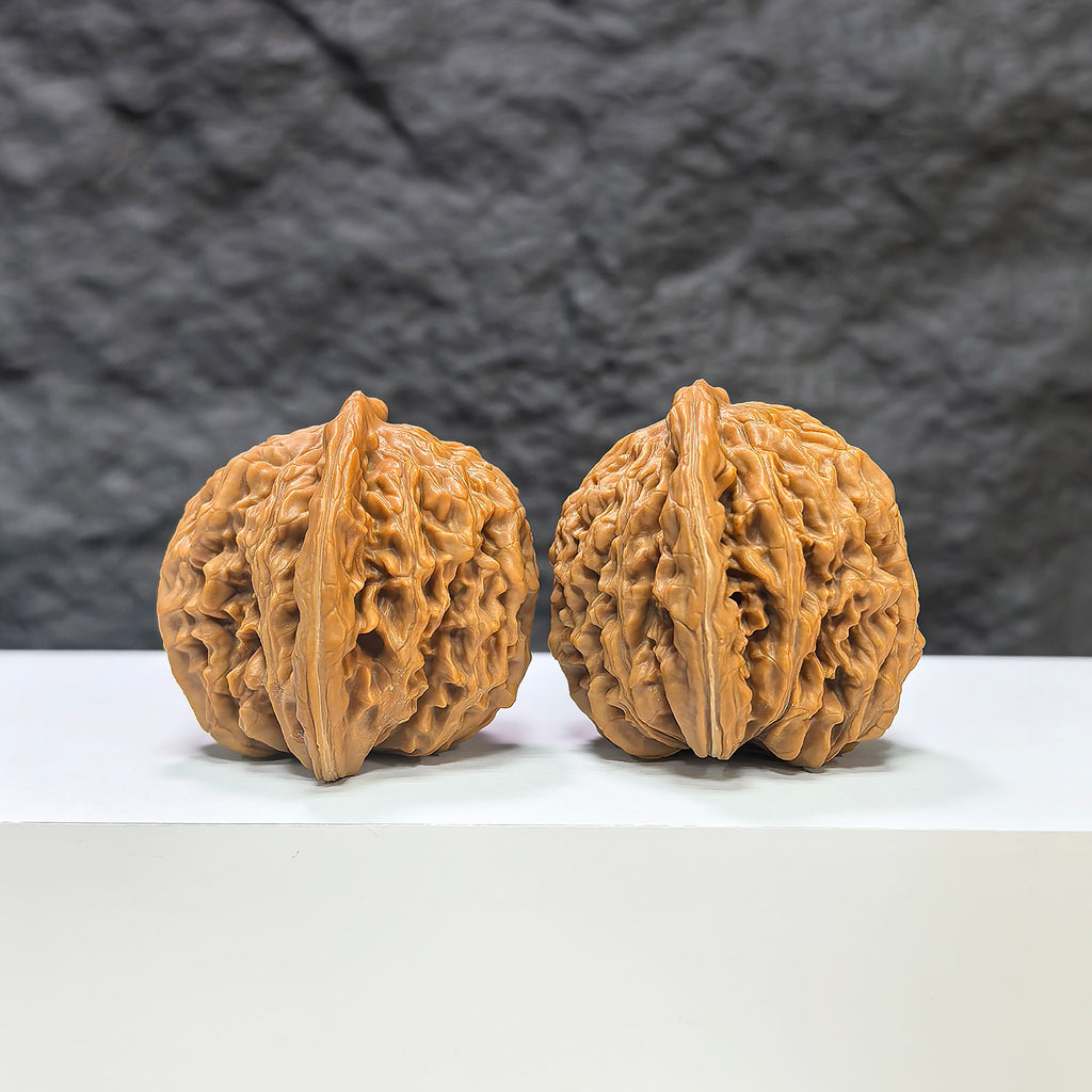 Pair of Sizuolou Wenwan walnuts by Wenwan Art, classic carved walnut stones, 41mm x 38mm, detailed natural wood grain.
