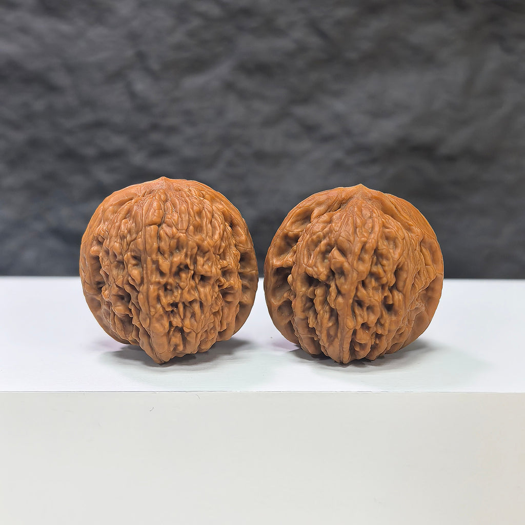 Pair of Meteorite Sycee Wenwan Walnuts by Wenwan Art, 30mm, featuring polished meteorite surfaces and traditional walnut shapes.