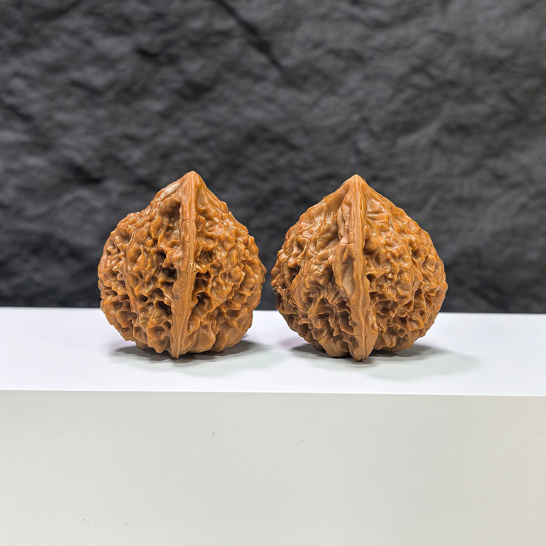 Pair of Golden Kylin Wenwan walnuts by Wenwan Art, 37mm x 38mm, featuring intricate natural wood grain and detailed carvings.