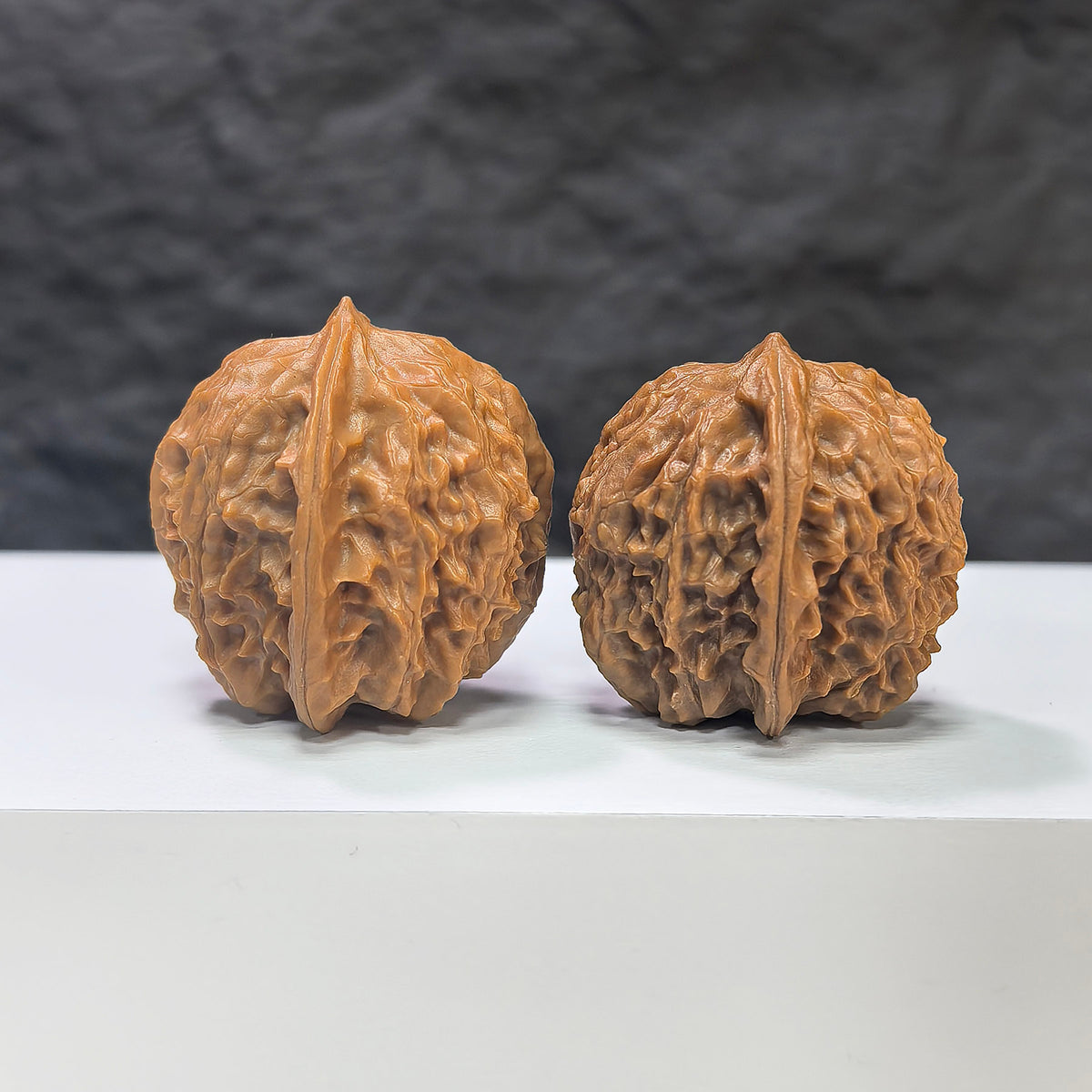 Pair of Wenwan Walnut miniatures with phoenix tail design, 30mm by 31mm, from Wenwan Art, showcasing detailed craftsmanship.