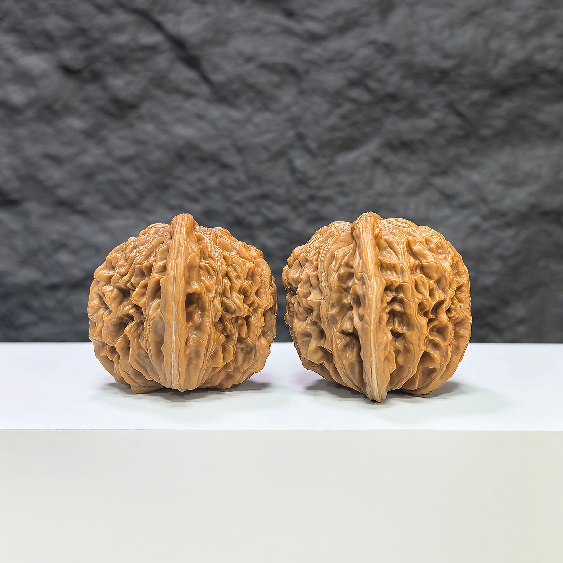 Pair of Sizuolou Wenwan Walnuts from Wenwan Art, 42mm x 38mm, showcasing smooth, polished classic walnut carvings.