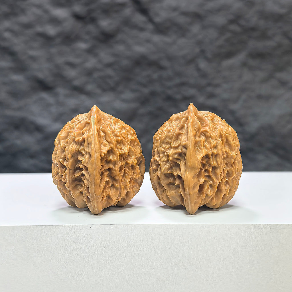 Pair of Wenwan Art miniature Wenwan walnuts from Xiayunling Pocket collection, measuring 32mm x 31mm, natural wood finish.