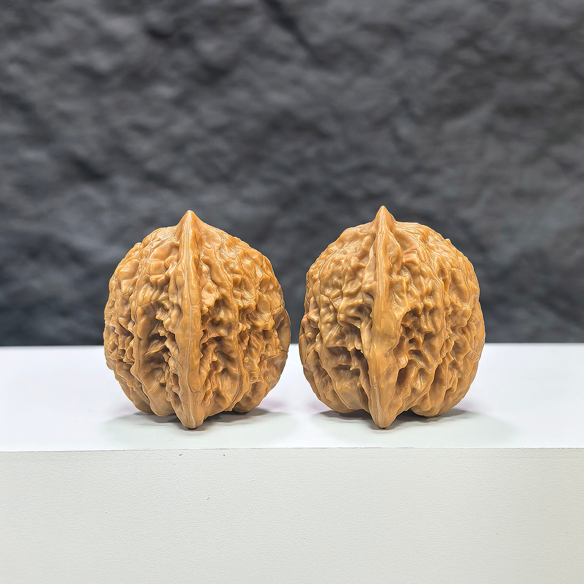 Pair of Wenwan Art miniature Wenwan walnuts from Xiayunling Pocket collection, measuring 32mm x 31mm, natural wood finish.