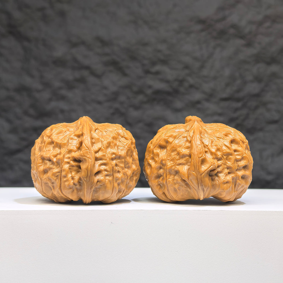 Pair of small pumpkin-shaped Wenwan walnuts from Wenwan Art, miniature size 38mm x 40mm, featuring detailed carvings.